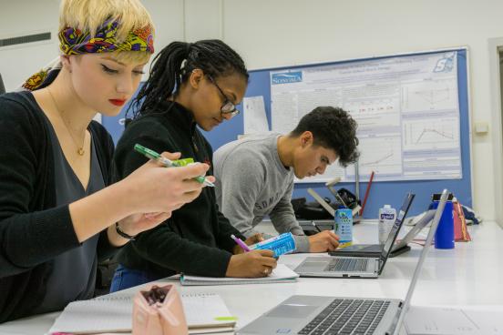 Students read nutritional information labels and take notes